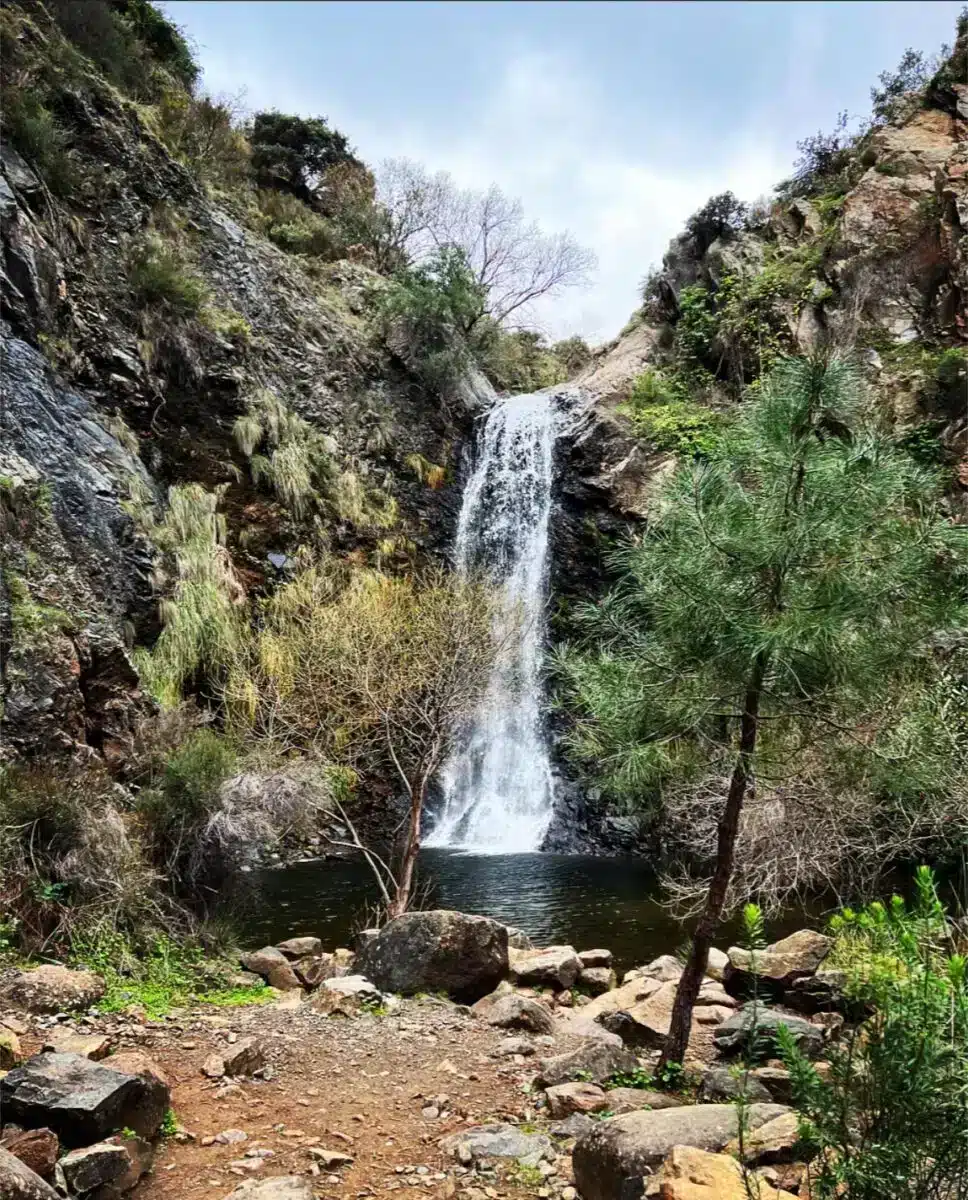 Natural waterfall in a lush green gorge near Costa del Soul retreat in Guaro Málaga