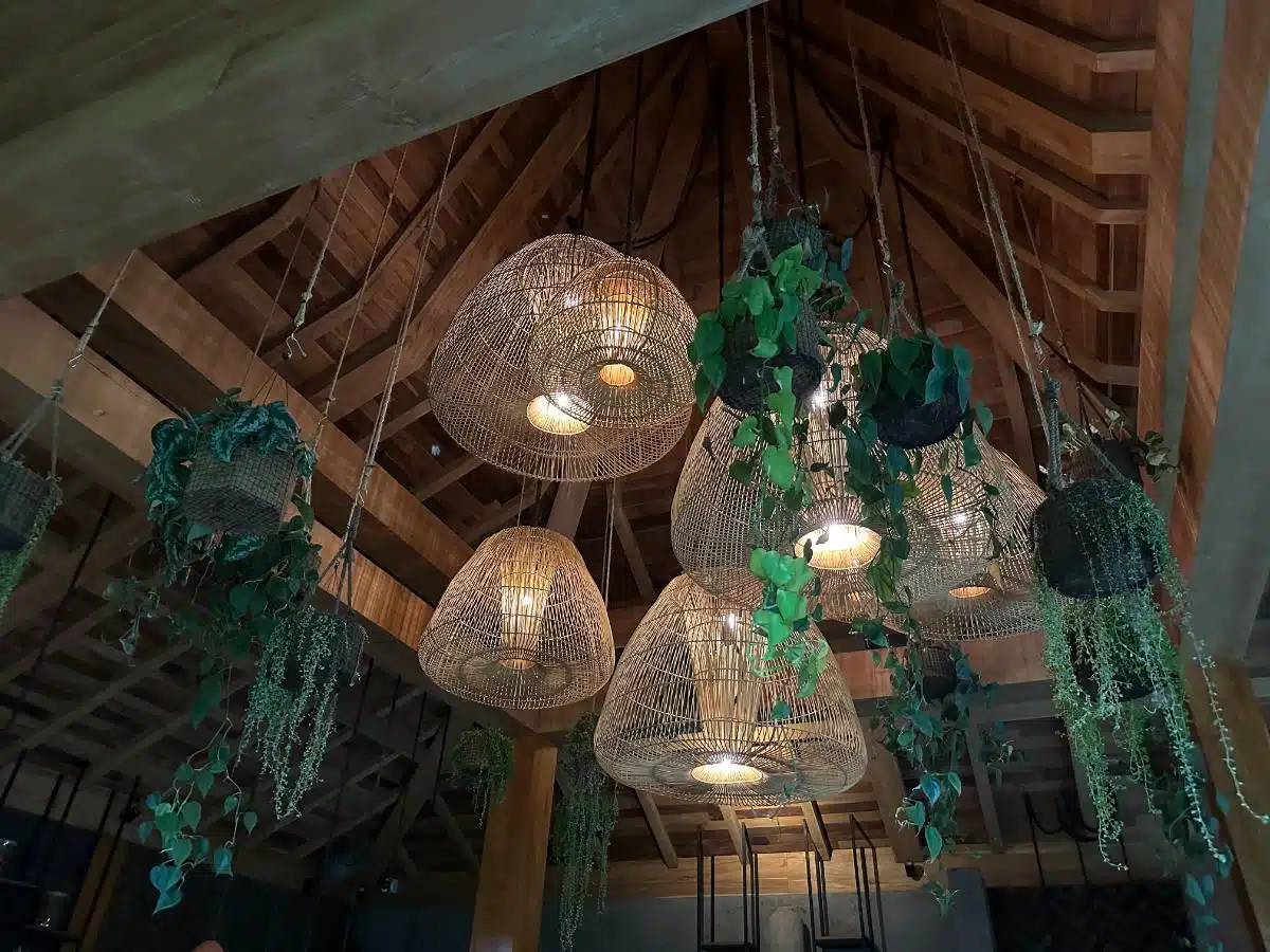 Decorative woven rattan pendant lights hanging in the Ijo restaurant at Desa Hay Bali