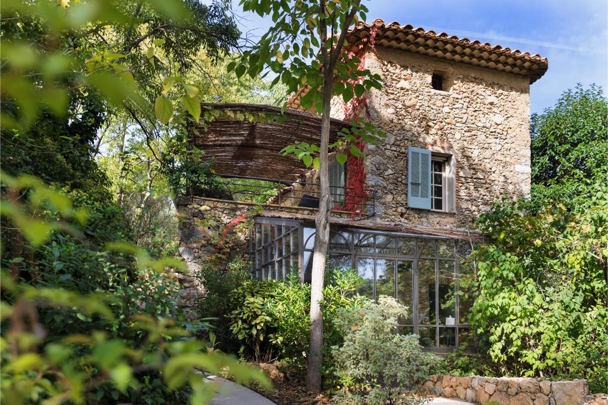 Le Bastidon rustic stone building with terrace and olive trees overlooking the Provençal countryside at Lou Calen