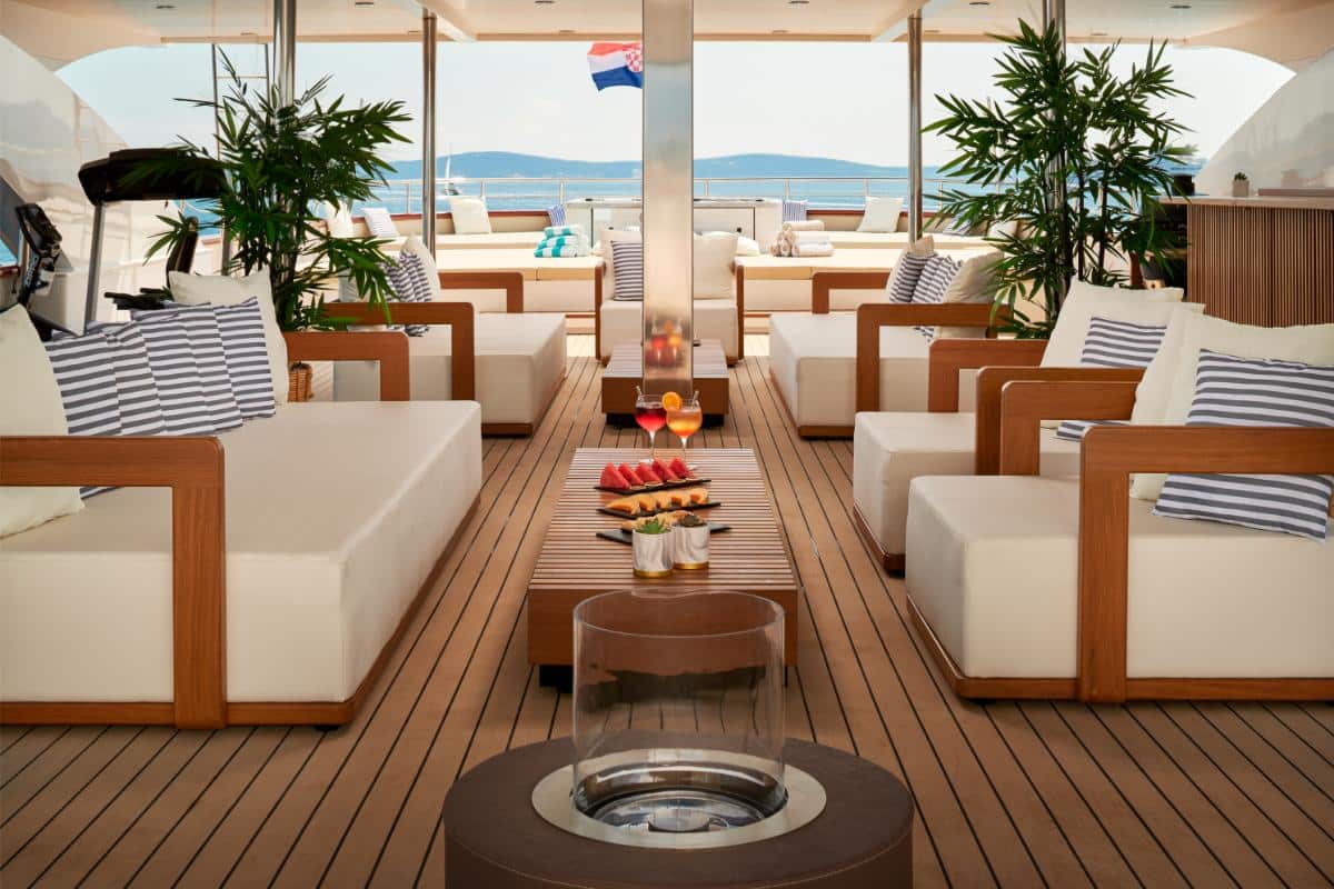 Ohana yacht sundeck with loungers sofas and jacuzzi overlooking the Croatian coast