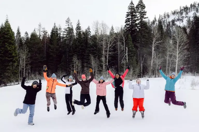 Charlotte Lilley with retreat participants at a mountain ski gathering
