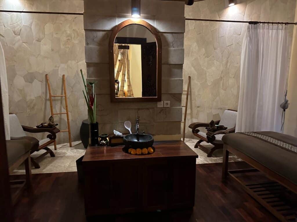 Private sauna cabin at Munduk Moding Plantation Bali with cedar wood interior, bench and white robe hanging ready