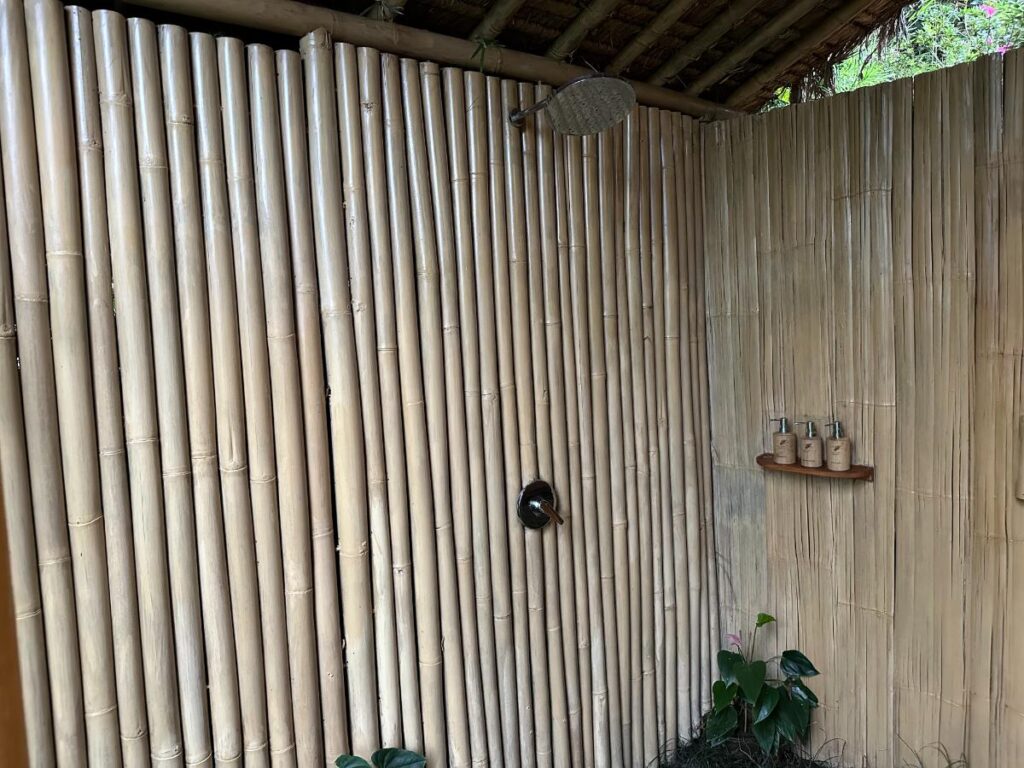 Fitness gym at Munduk Moding Plantation Bali with treadmills, cardio machines and large windows overlooking highland jungle